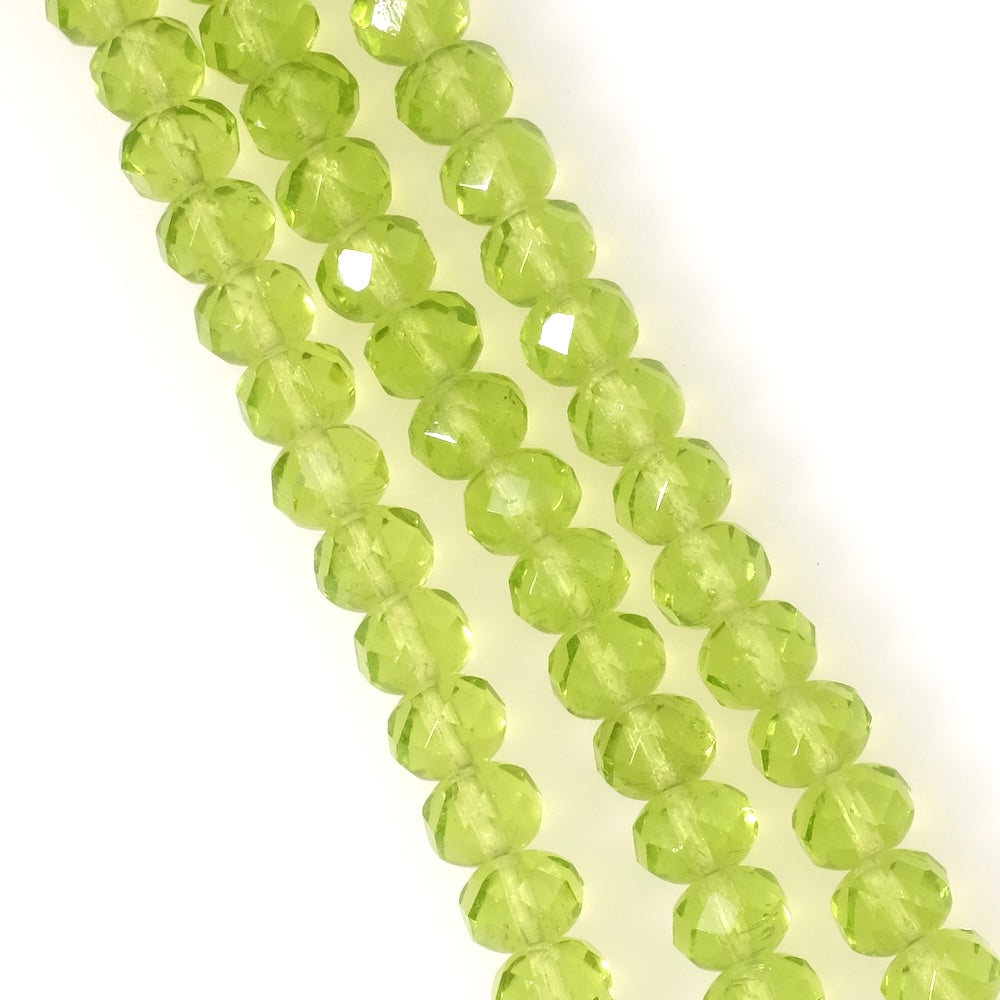 Fil de perles de Bohème facettées 6x8mm vert anis transparent