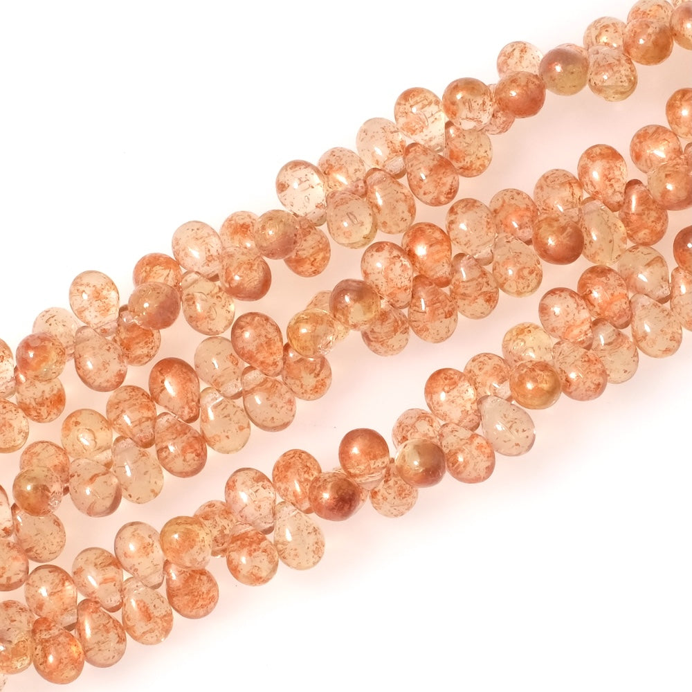 Fil de perles de Bohème gouttes 5x7mm Vert pastel transparent moucheté cuivré