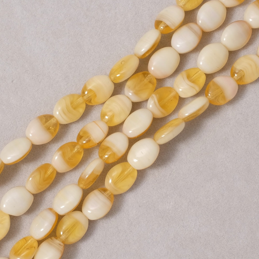 Fil de perles de Bohème ovales 9x7mm nuances de jaune et crème