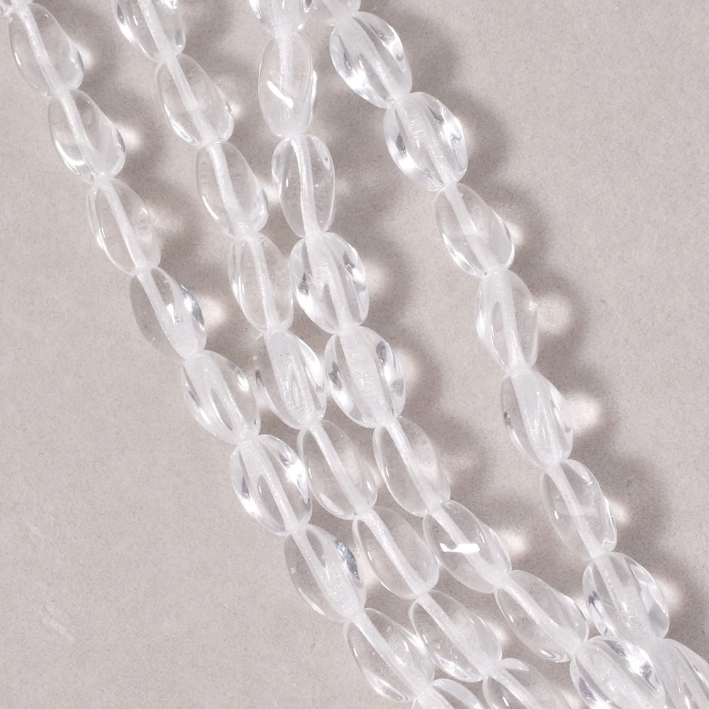 Fil de perles de Bohème ovales twistées 9x6mm transparent