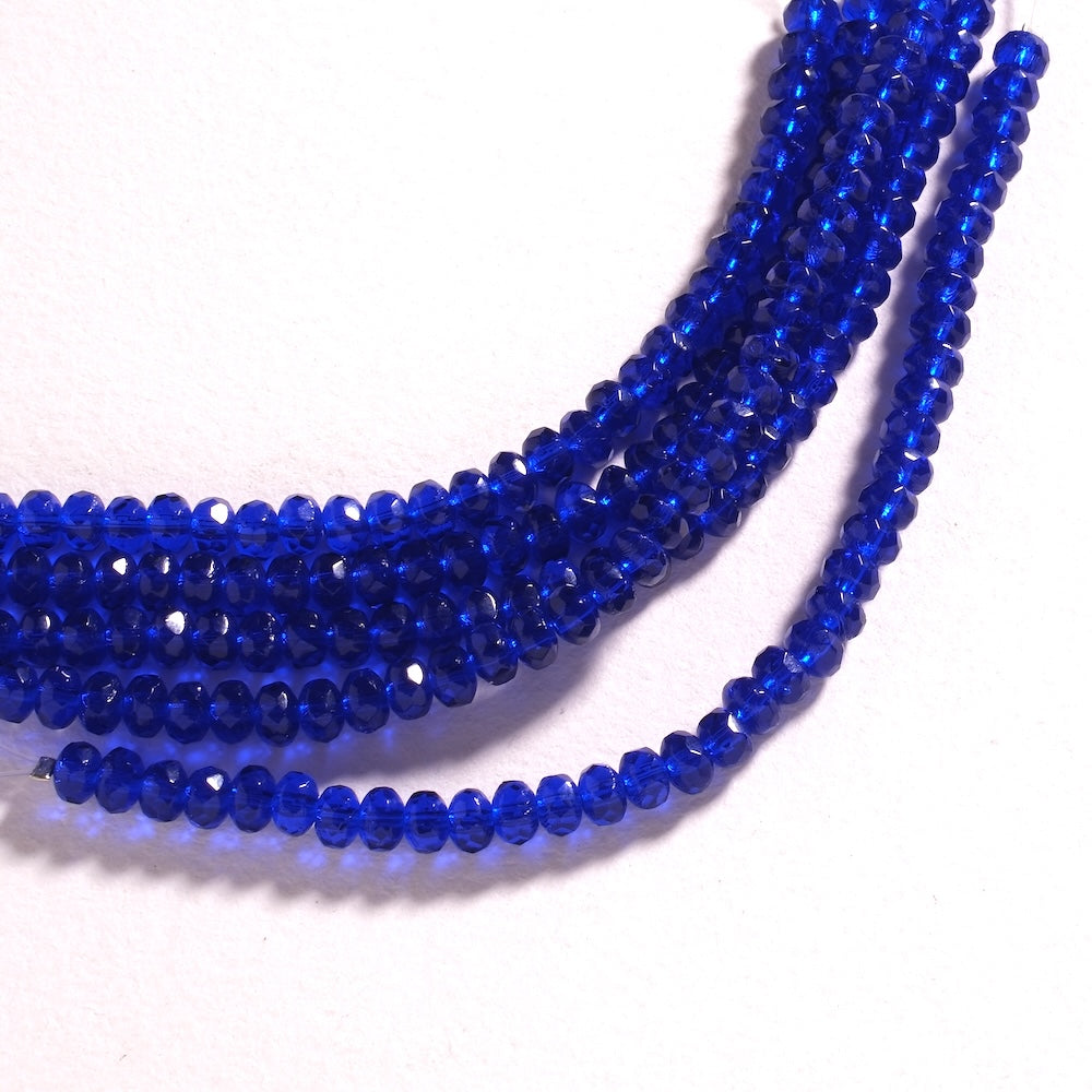 Fil de perles de Bohème rondelles facettées 3 x 5 mm en verre bleu roi transparent