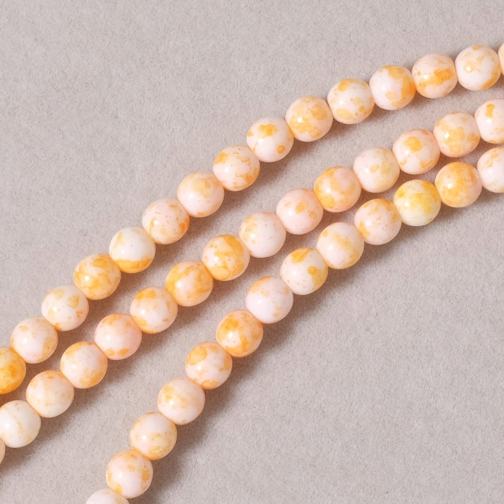 Fil de perles de Bohème rondes 5mm blanc moucheté orange
