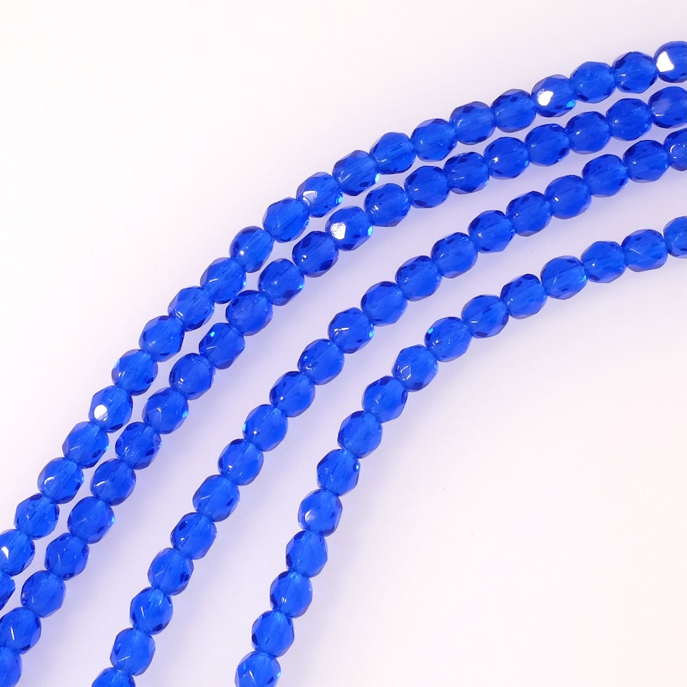 Fil de perles de Bohème rondes facettées 4mm bleu intense transparent