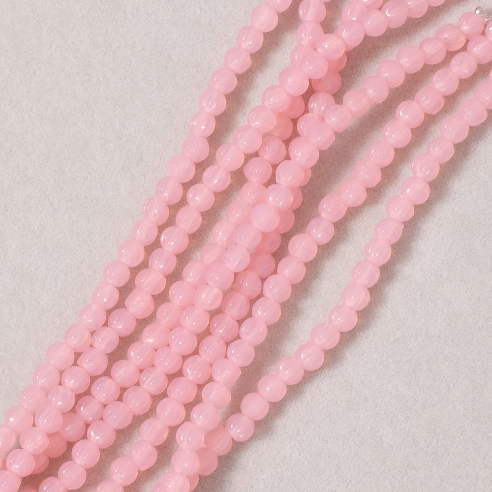 Fil de perles de Bohème rondes striées 3mm rose semi opaque