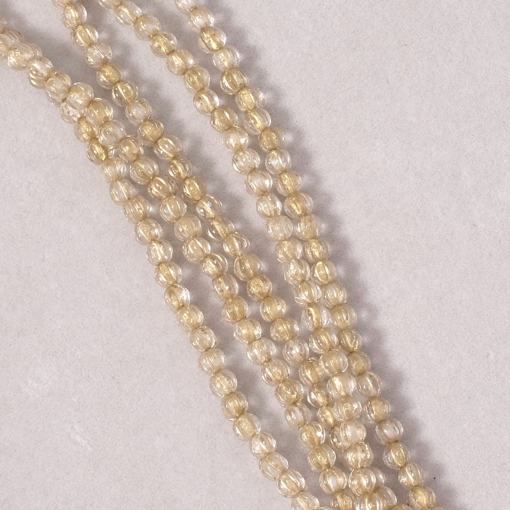 Fil de perles de Bohème rondes striées 3mm transparent et doré