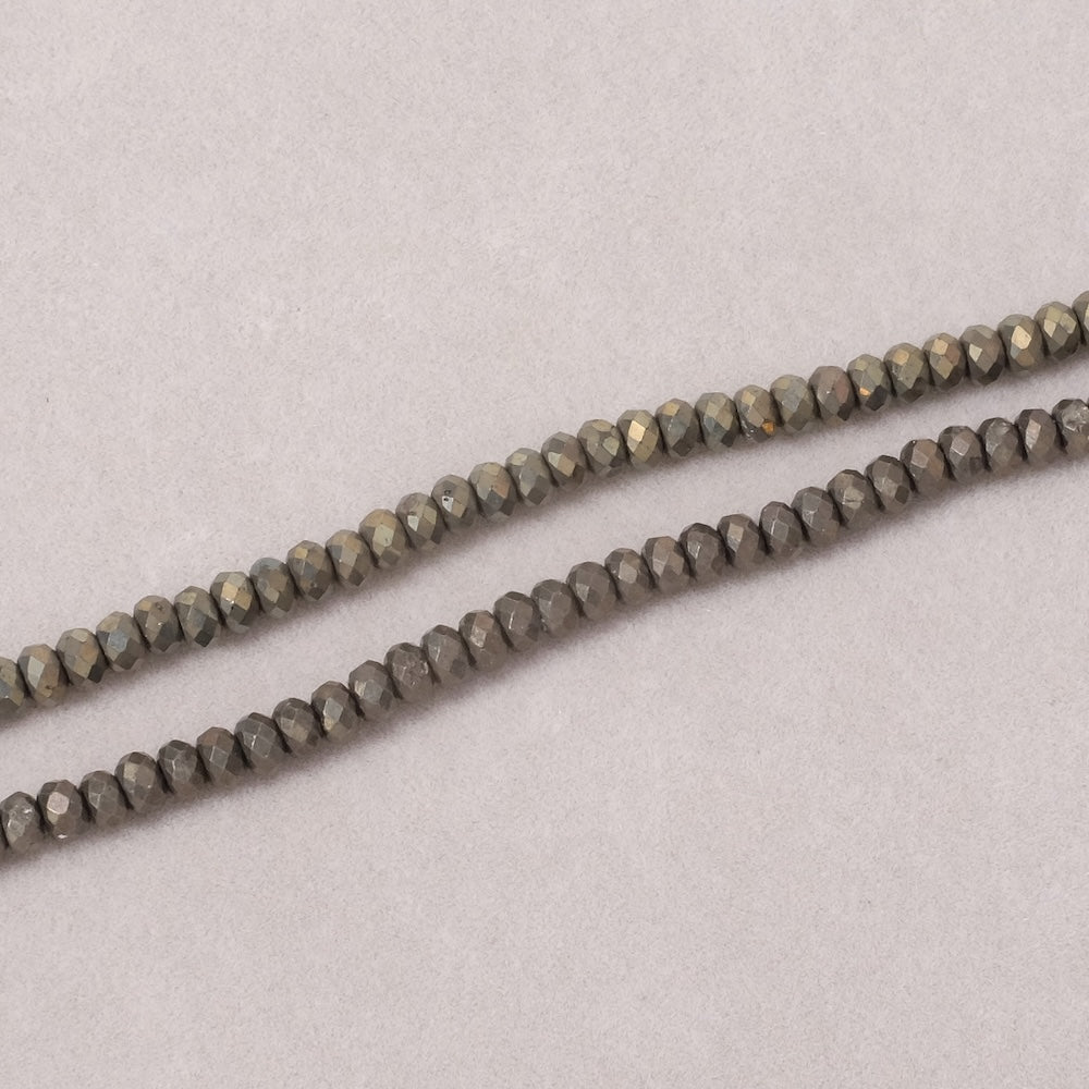 Fil de perles naturelles donuts facettées 4x3mm en Pyrite