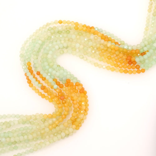 Fil de perles naturelles facettées 3mm en Jade dégradé vert pastel et orange.