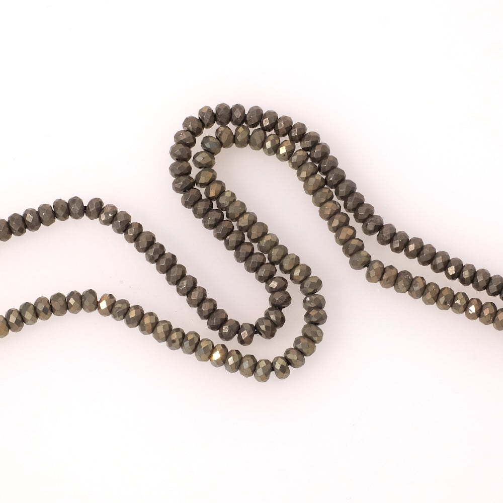 Perles naturelles donuts facettées 4x3mm en Pyrite