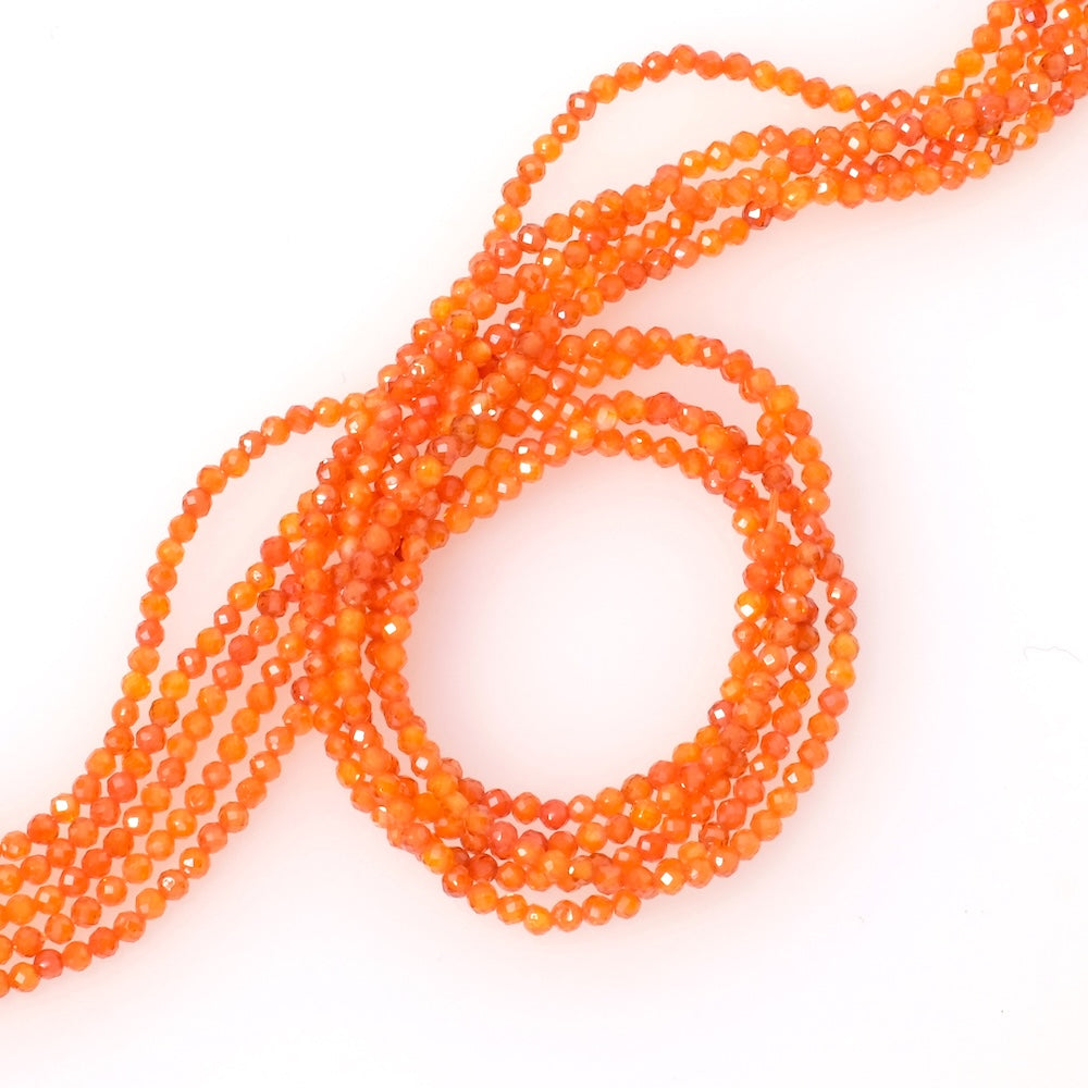 Fil de perles ronde facettée 2mm en Oxyde de Zirconium orange ou Zircone cubique