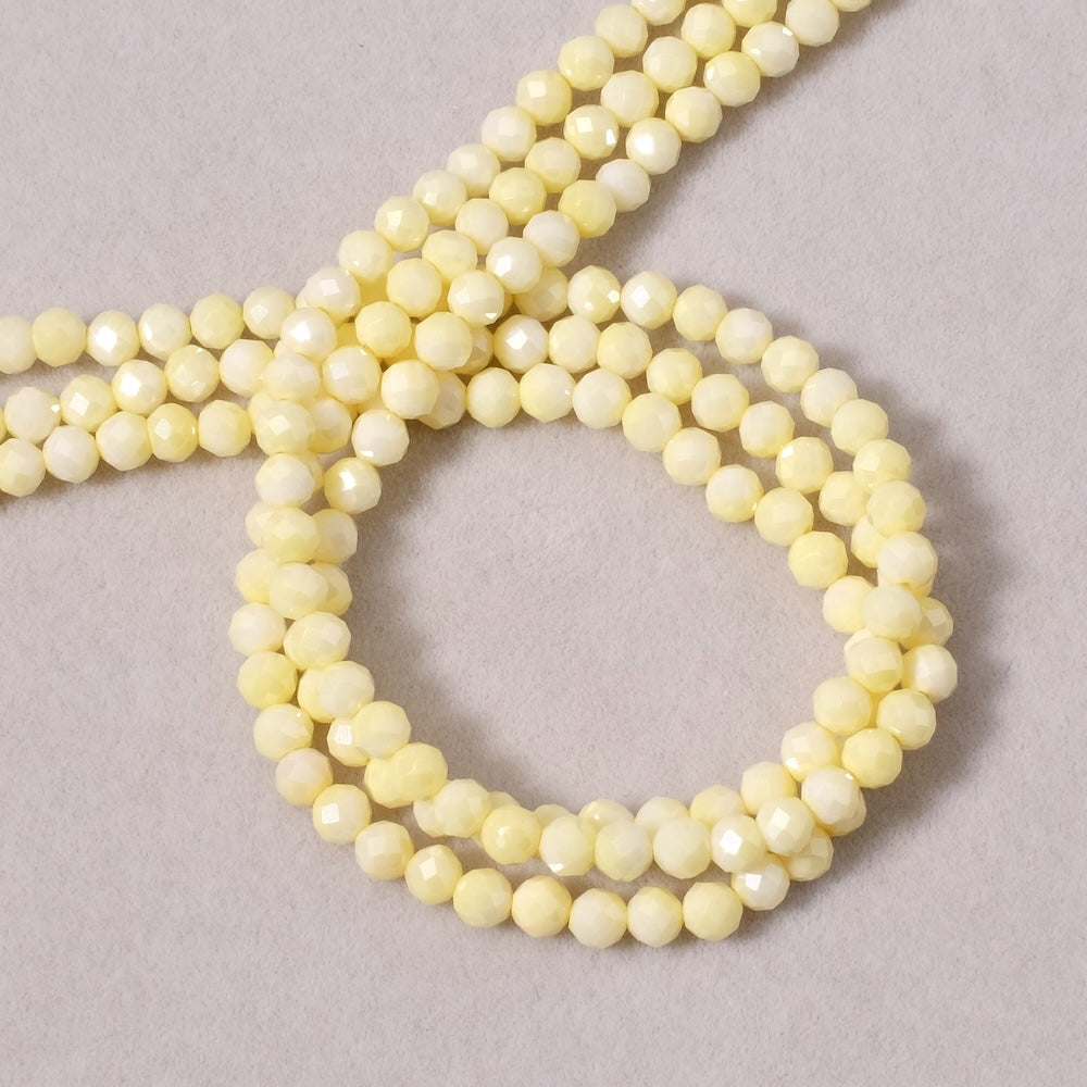 Fil de perles ronde facettée 3,4mm en Oxyde de Zirconium ou Zircone cubique jaune pastel