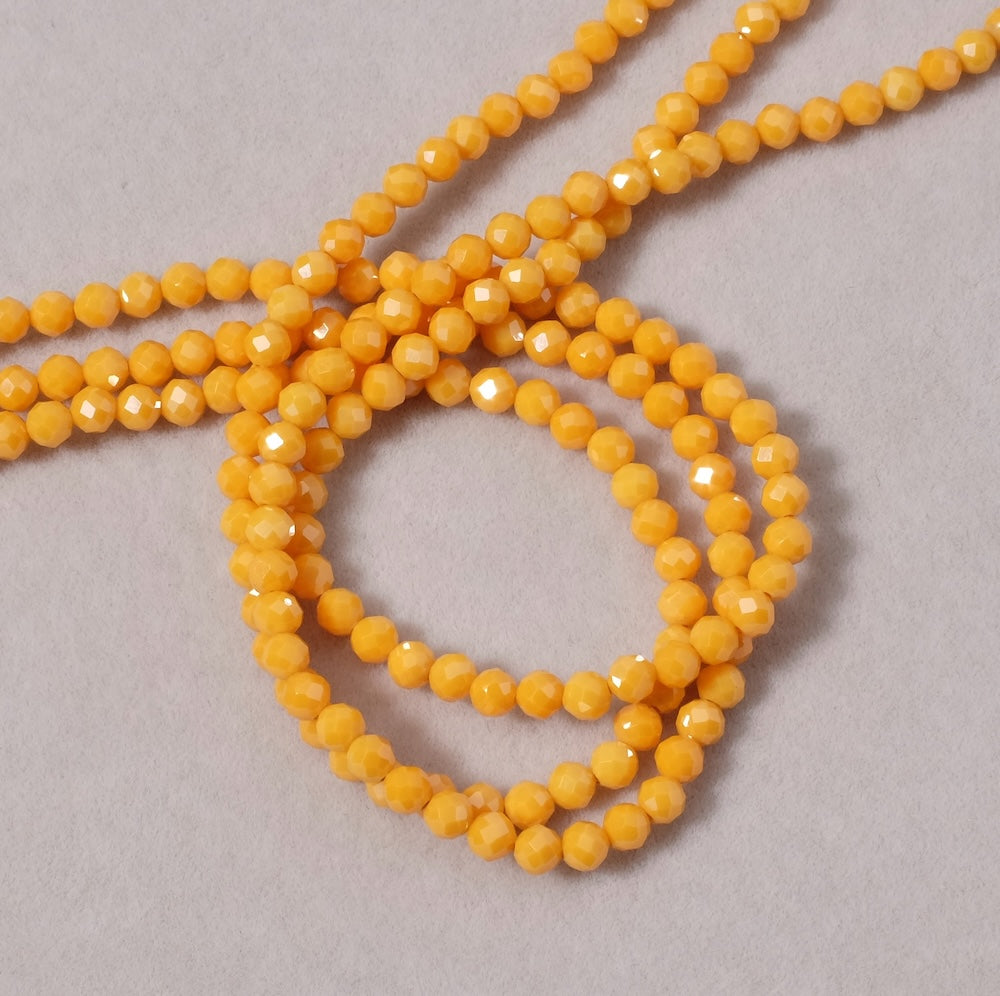 Fil de perles ronde facettée 3,4mm en Oxyde de Zirconium ou Zircone cubique orange