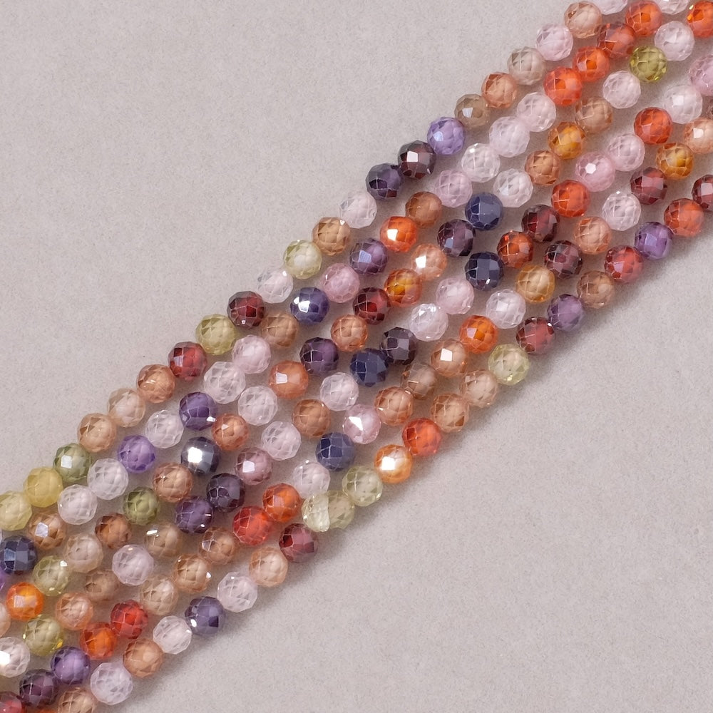 Fil de perles ronde facettée 4mm en Oxyde de Zirconium ou Zircone cubique multicolore