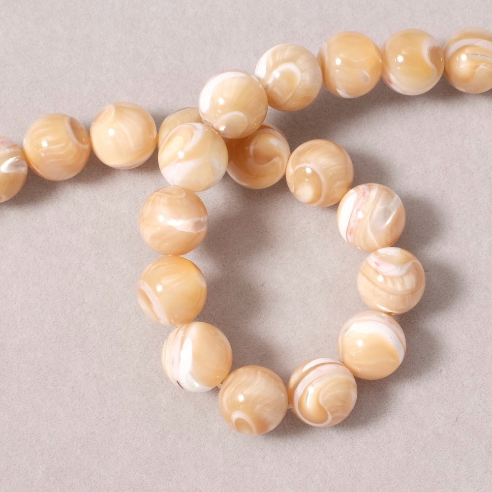 Fil de perles rondes 10mm en Nacre naturelle beige