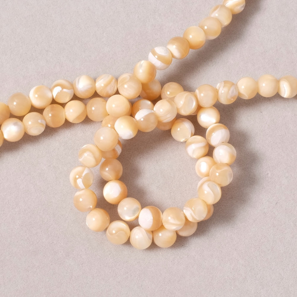 Fil de perles rondes 6mm en Nacre naturelle beige