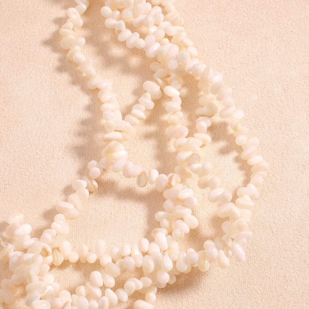 Fil de perles goutte irrégulières 6,5mm en Nacre naturelle blanche