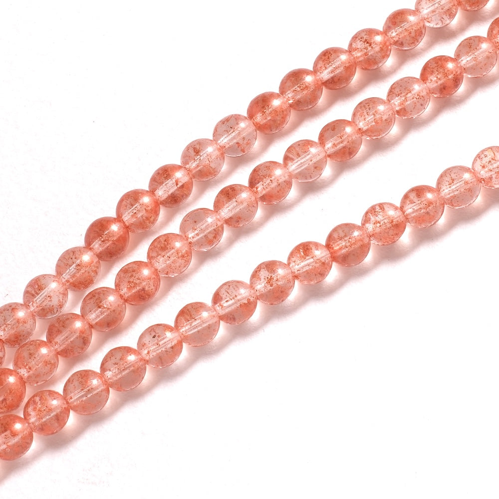 Perles rondes 6 mm rose translucide, inclusions cuivrées scintillantes dans le verre