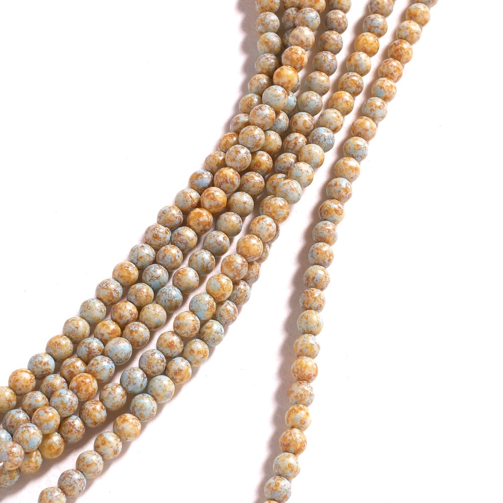 Rangs de perles rondes 4 mm bleu pâle mouchetées d'ocre, finition Picasso