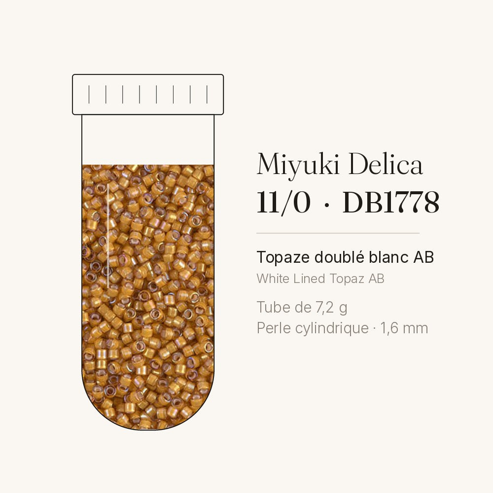 Tube de 7,2 g de perles Miyuki Delica 11/0 DB1778 topaze doublé blanc AB