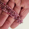 Vidéo du fil de perles en spinelle multicolore facetté 3 mm, tons framboise