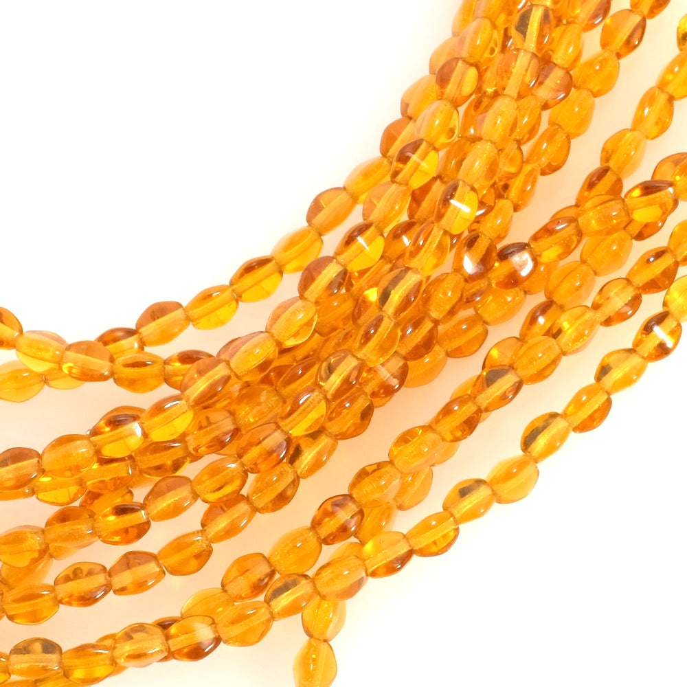 Fil de perles de Bohème Olives facettées 5mm ambre transparent