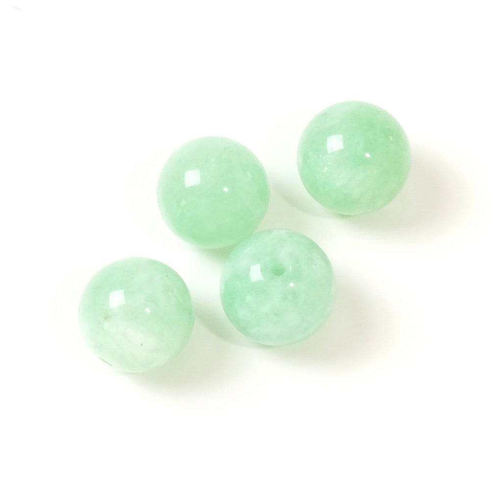 4 perles rondes naturelles de jade de Birmanie de 10mm.
