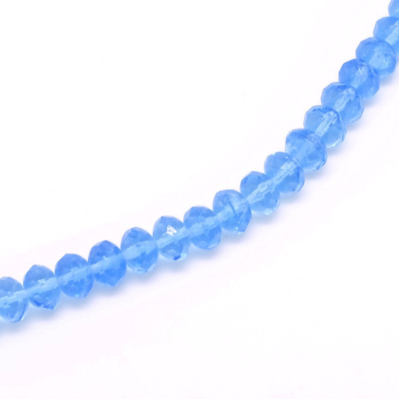 Fil de 20 perles de Bohème en verre à facettes 6x8mm bleu transparent 