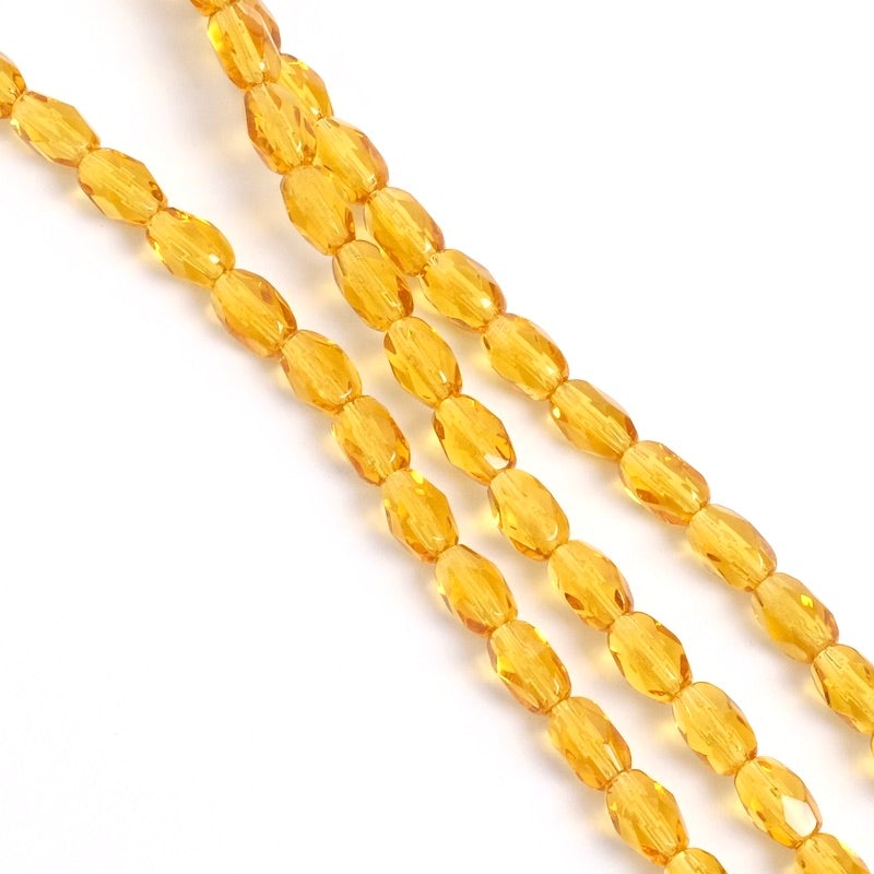 Fil de perles de Bohème Olives facettées 6x4mm ambre transparent