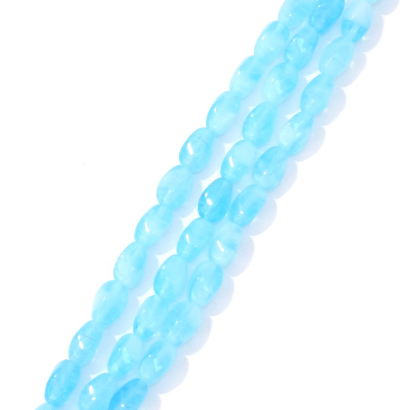 Fil de perles de Bohème ovales twistées 9x6mm Bleu ciel transparent