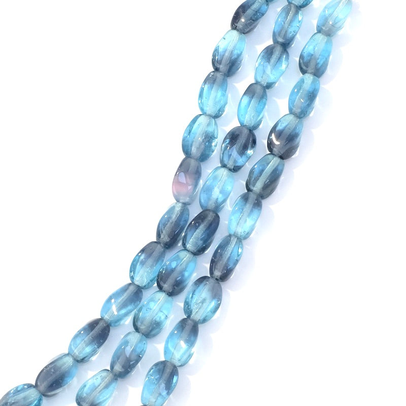 Fil de perles de Bohème ovales twistées 9x6mm Bleu jeans transparent