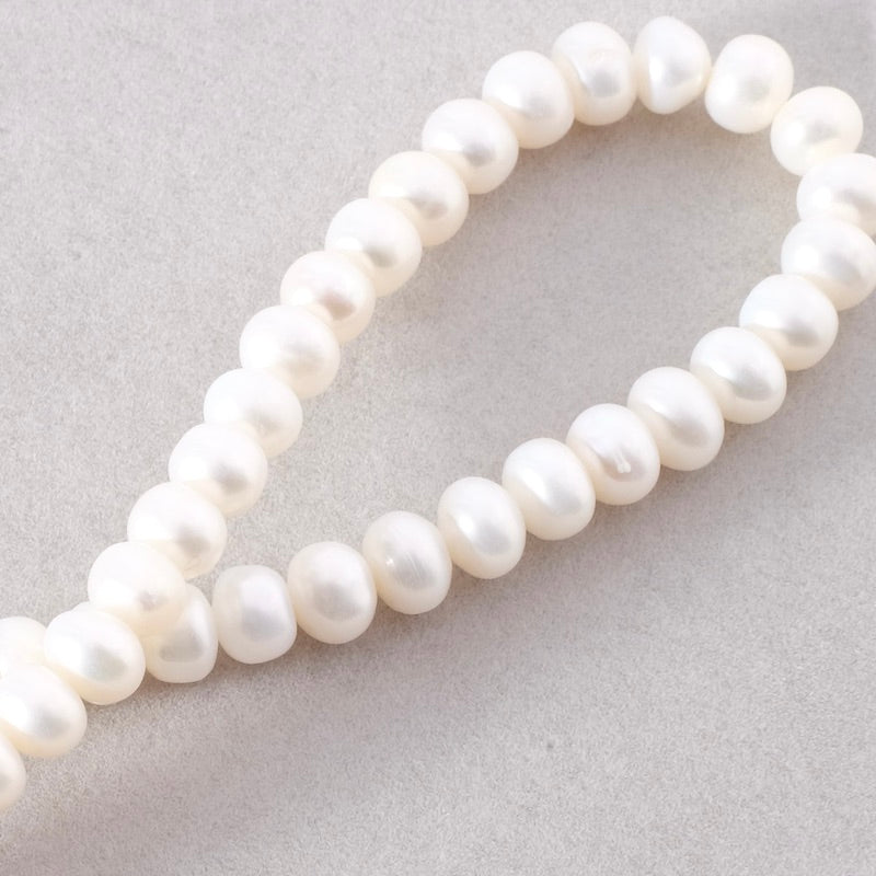 Fil de perles de culture 7mm irrégulières de Nacre naturelle