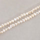 Fil de petites perles 5mm irrégulières de Nacre naturelle