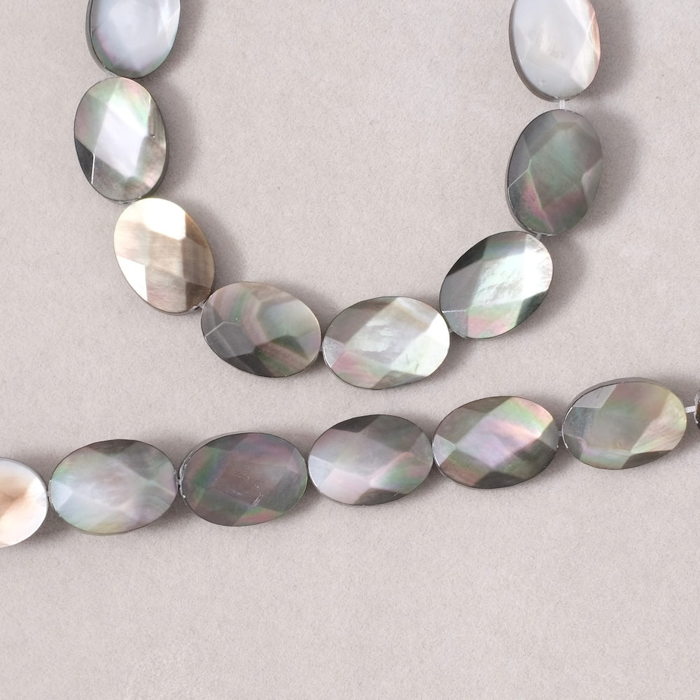 2 faceted oval beads 10x14mm in very fine quality Black Mother-of-Pearl