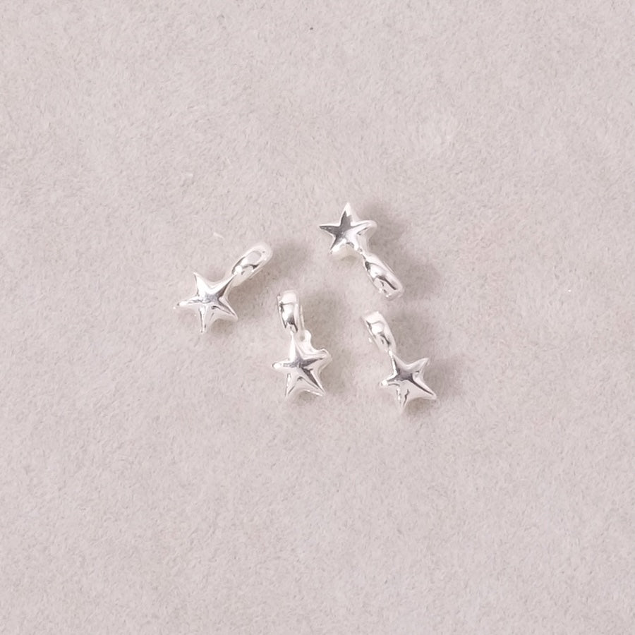 4 star-shaped slider beads in silver Zamak