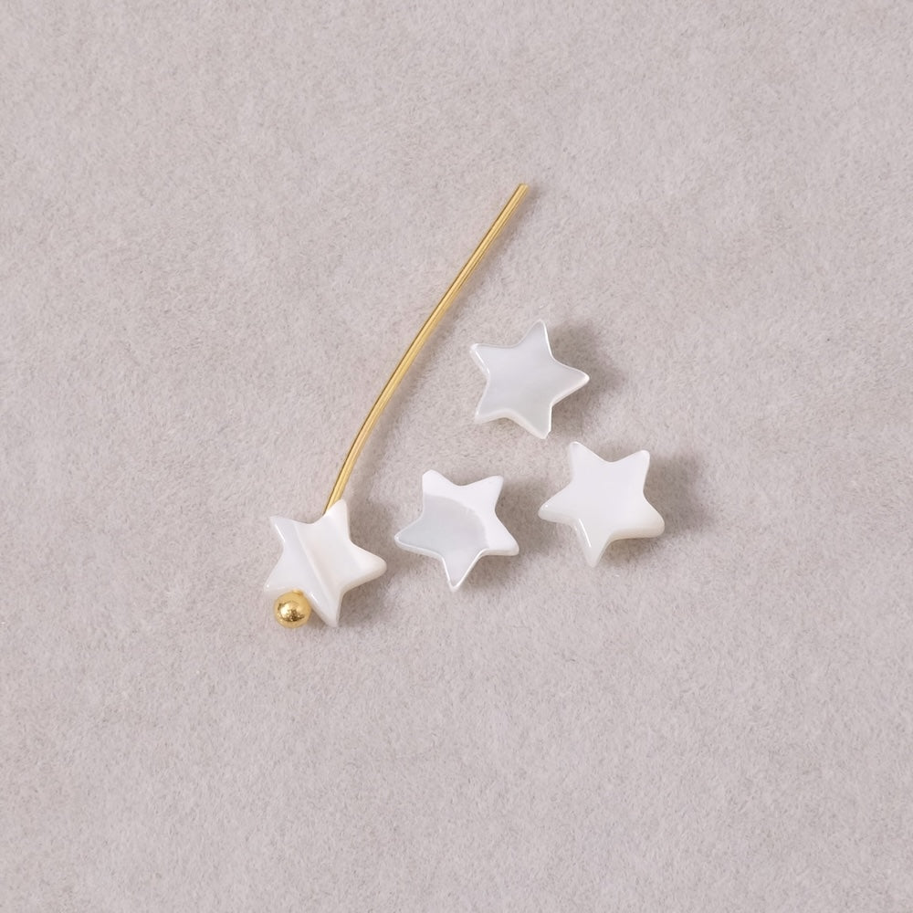 4 small white natural mother-of-pearl star beads