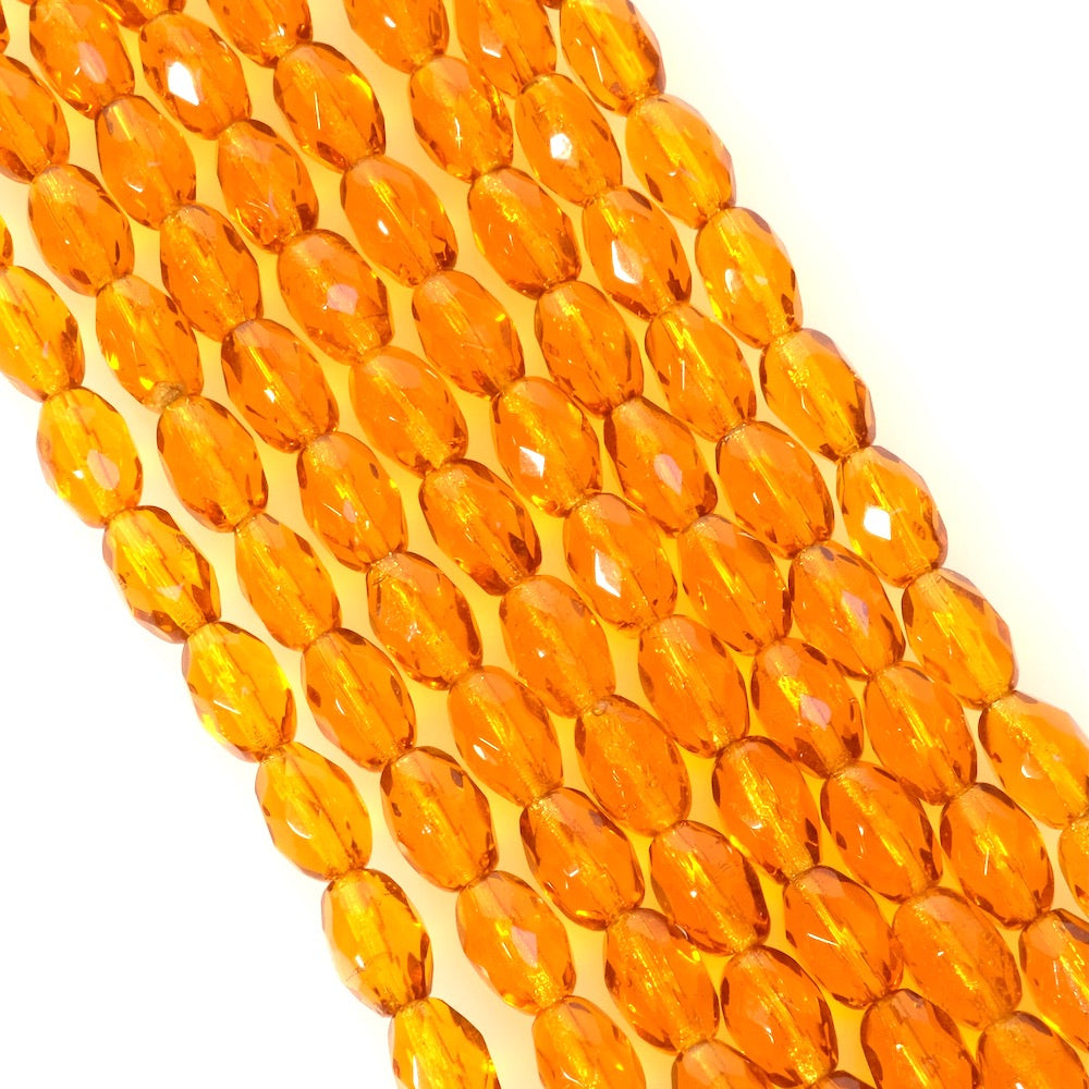 Strand of Bohemian Olives faceted beads 9x6mm orange honey transparent