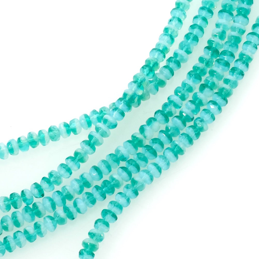 Strand of Bohemian Donuts faceted beads 2x3mm turquoise transparent
