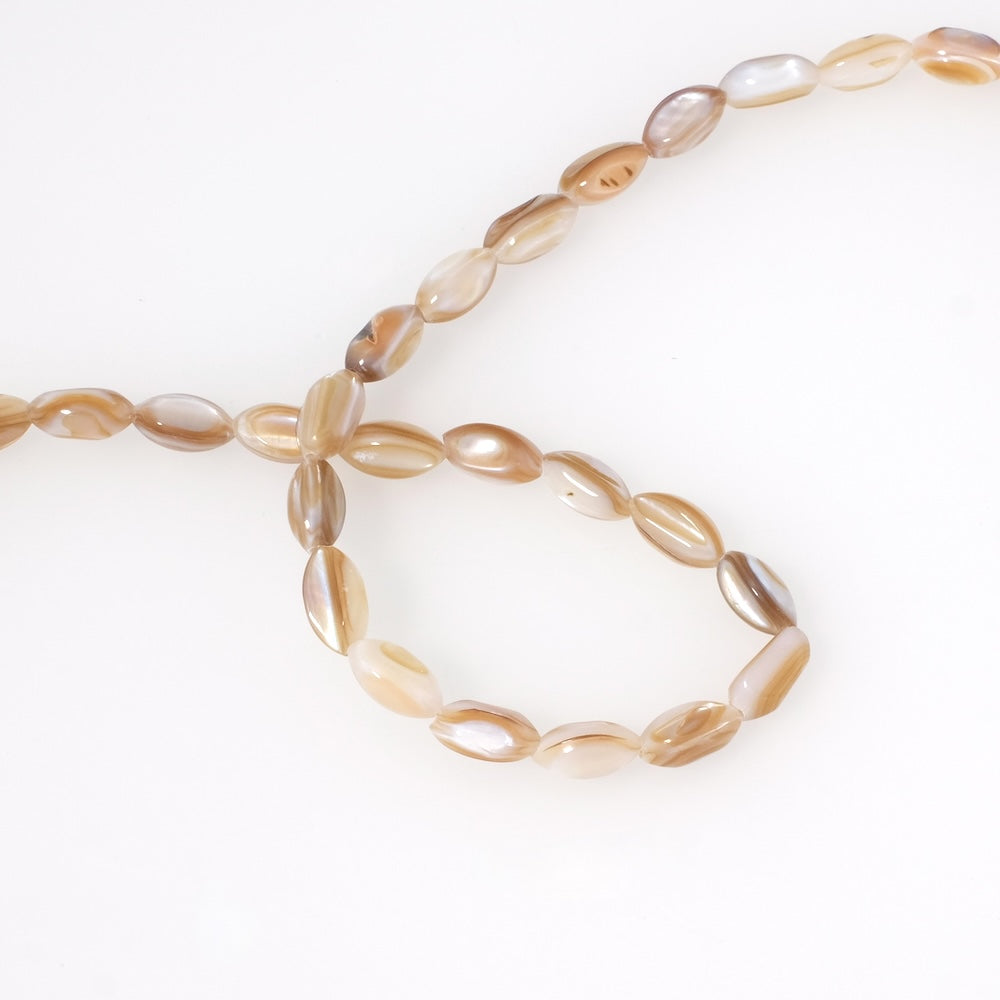 10 oval beads in natural beige Mother-of-Pearl
