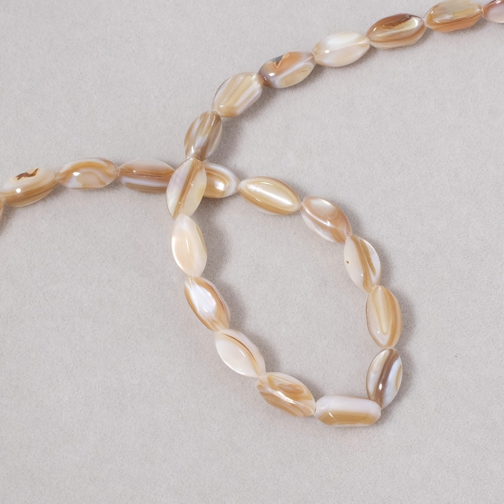 10 oval beads in natural beige Mother-of-Pearl