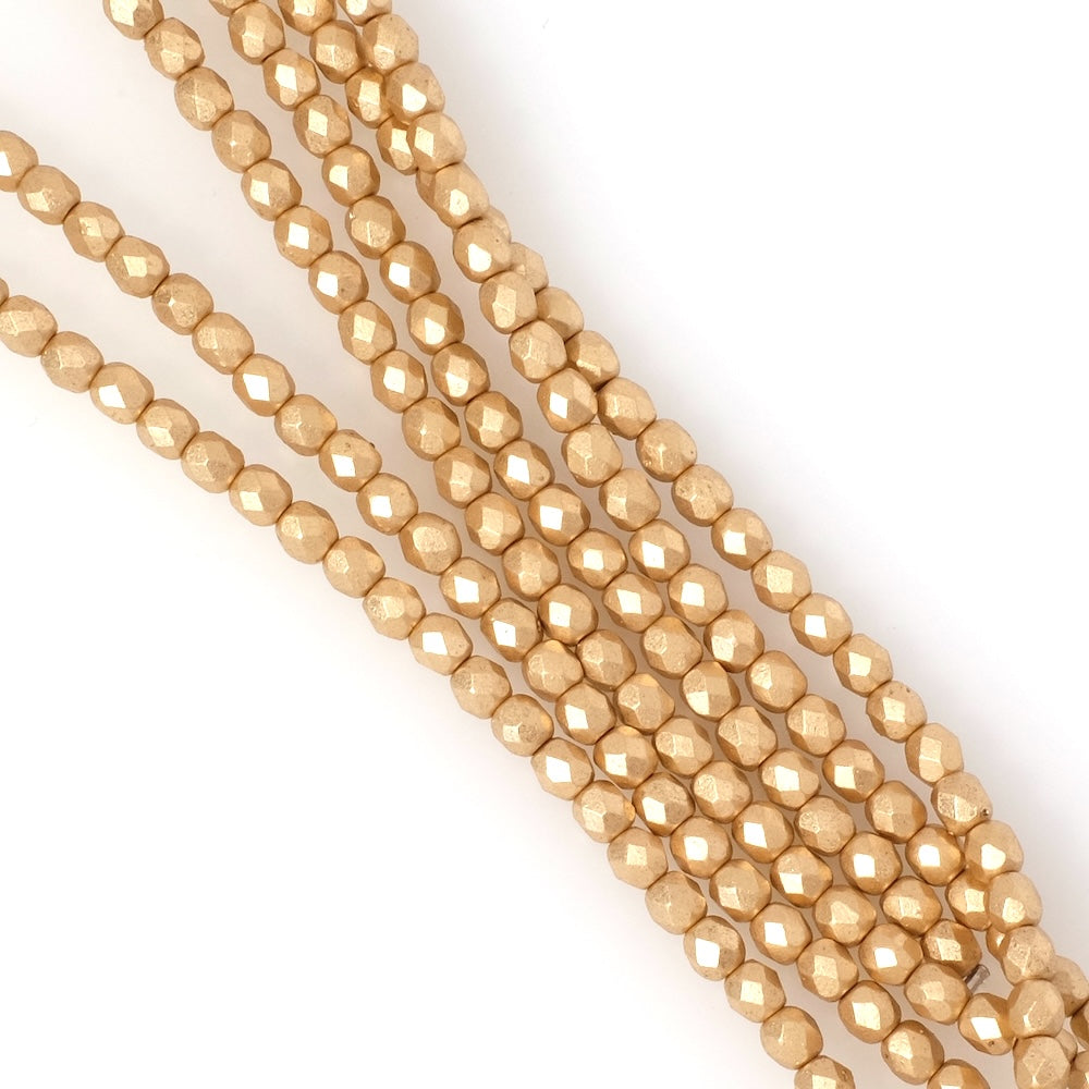 Strand of round faceted Bohemian beads 4 mm light gold metallic