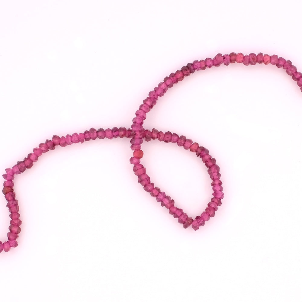 Strand of natural irregular faceted 3mm beads in Rhodolite Garnet