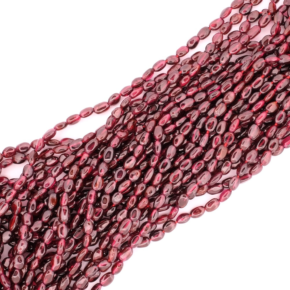 Strand of natural irregular oval 6mm beads in Almandine Garnet