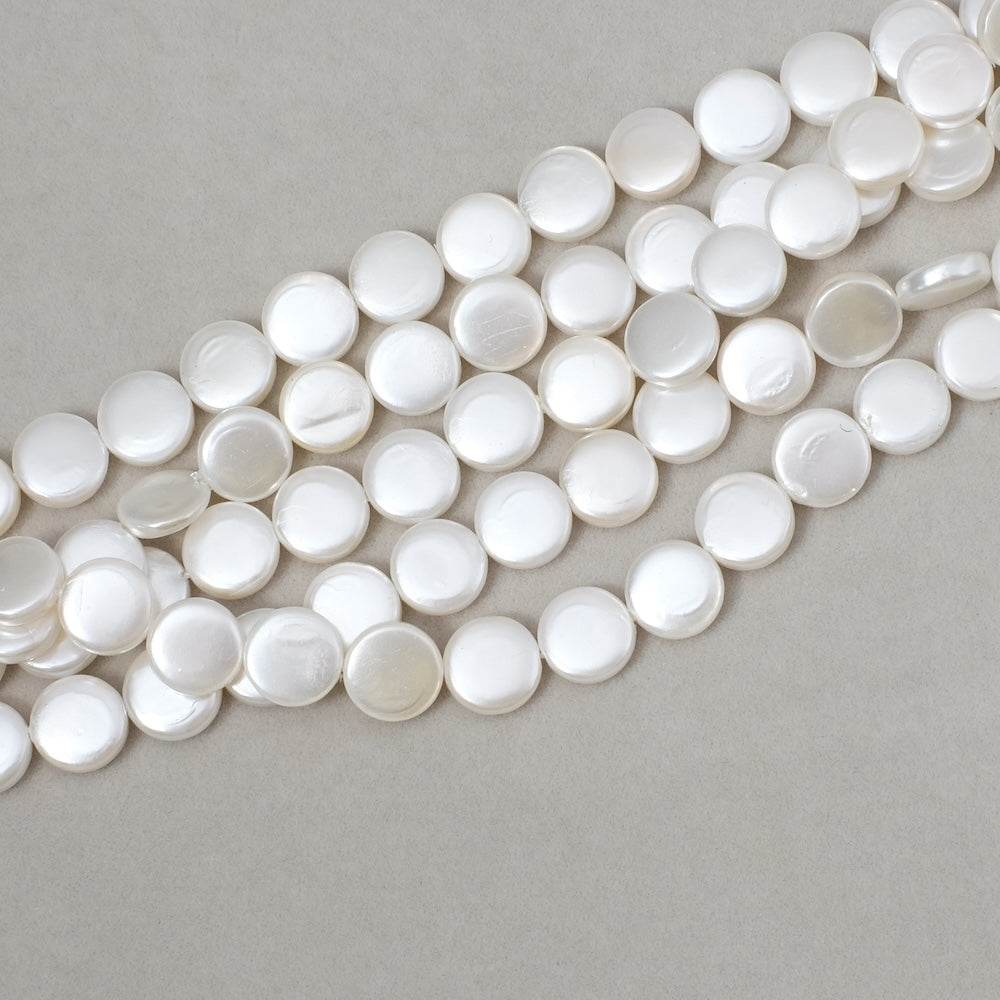 Strand of 8mm disc beads in white Mother-of-pearl
