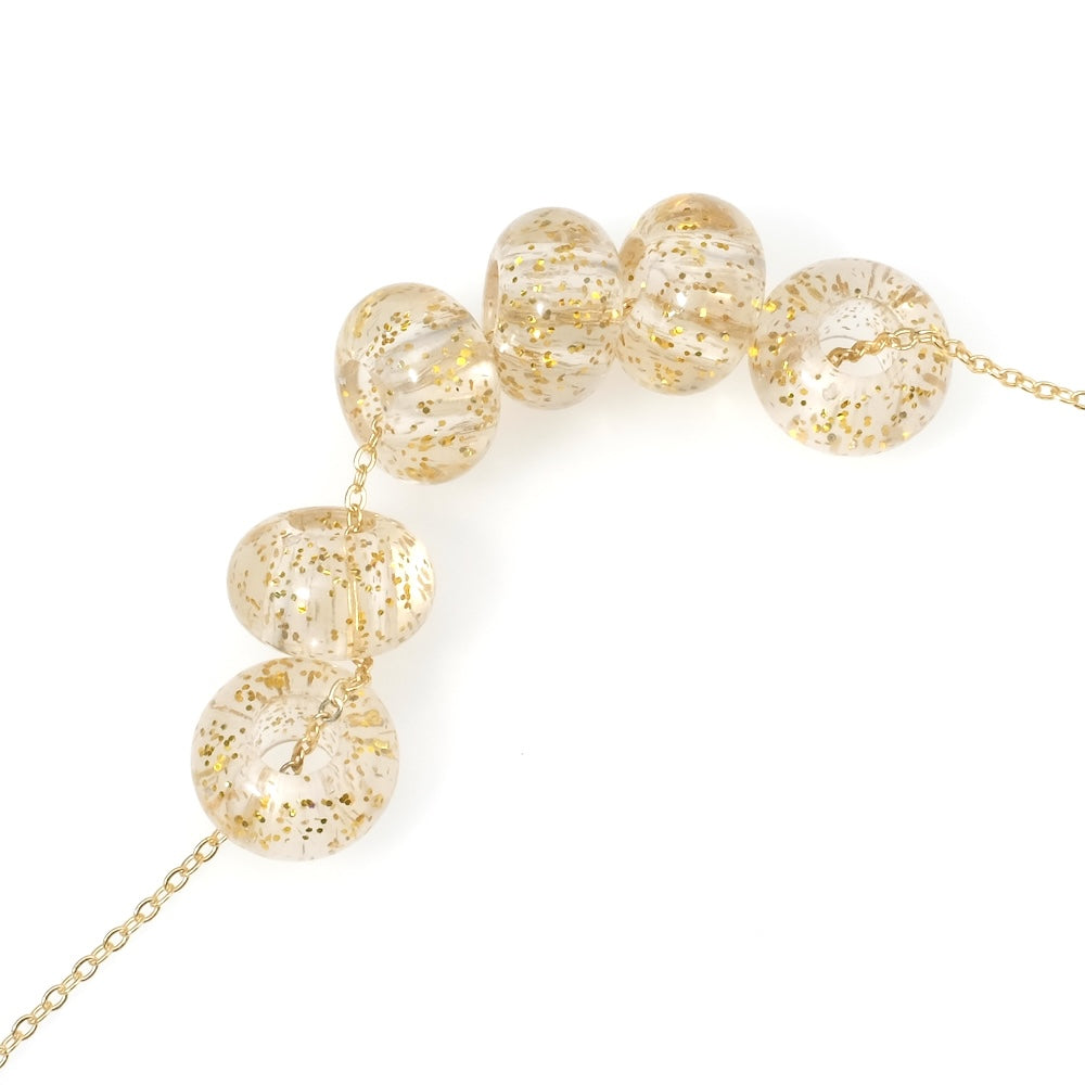 6 donut beads 14mm in transparent acrylic with gold glitter