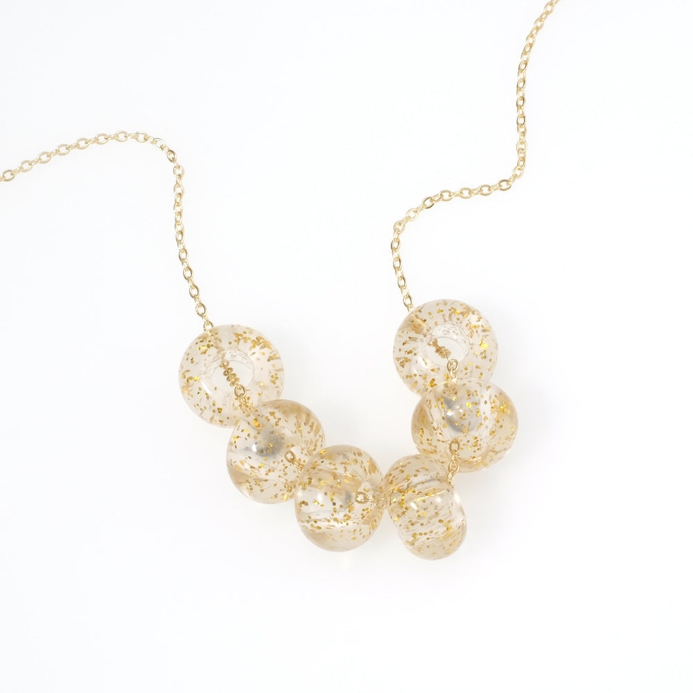 6 donut beads 14mm in transparent acrylic with gold glitter