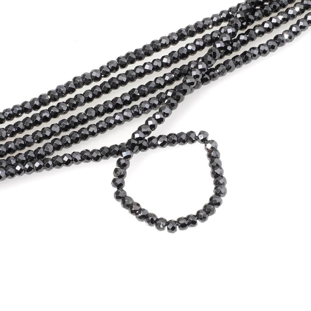 Strand of 3mm faceted donut beads in black Zirconium Oxide or Cubic Zirconia