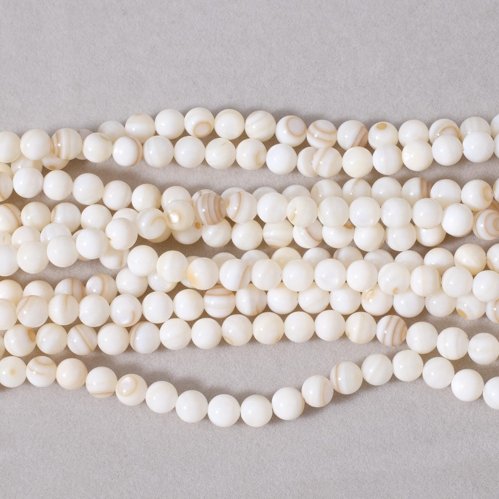 Strand of 6mm round beads in Mother-of-pearl