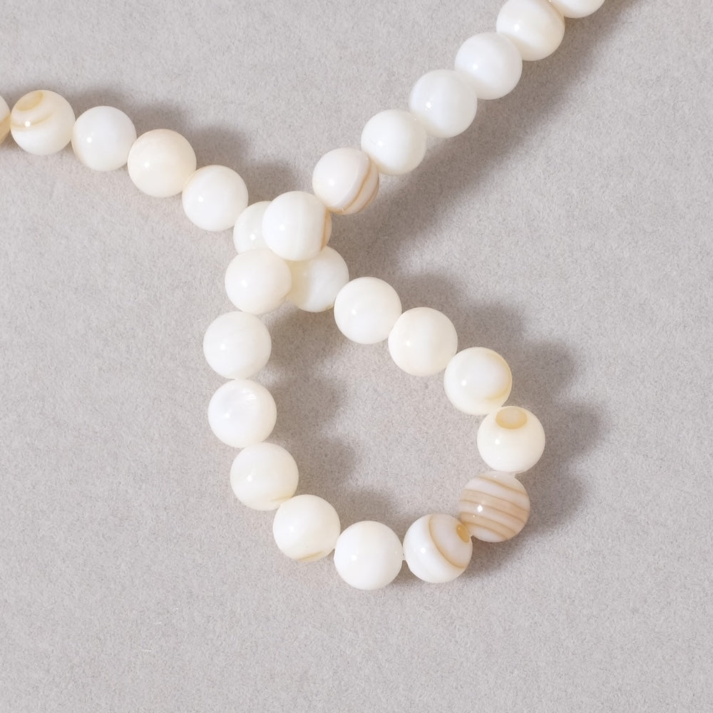 Strand of 6mm round beads in Mother-of-pearl