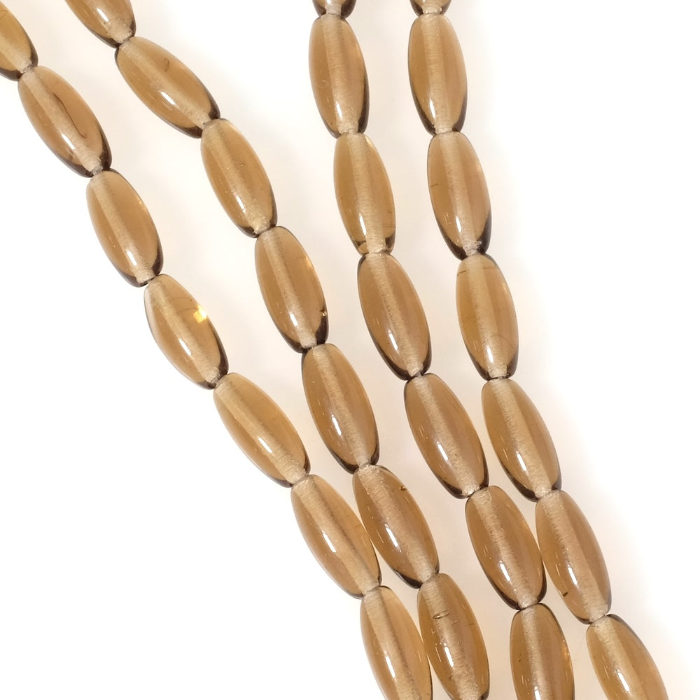 Strand of Bohemian oval beads, 6x13mm, transparent brown