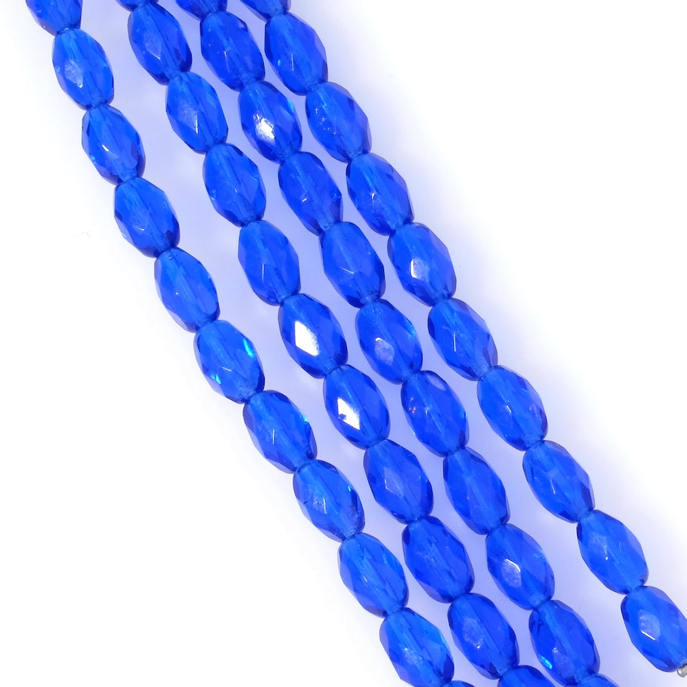 Strand of Bohemian faceted olive beads, 9x6mm, transparent royal blue