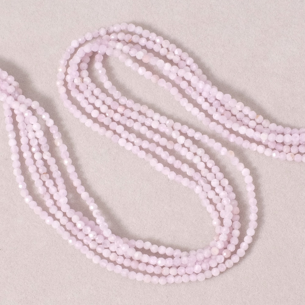Strand of 2mm faceted round natural Kunzite beads